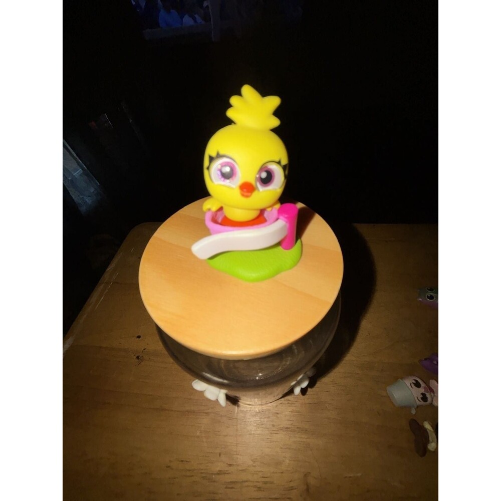 Disney Doorables Ticket to Fun Series Ducky Figure with Carousel/Jar Base